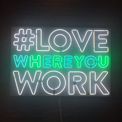 neon sign that says LOVE WHERE YOU WORK